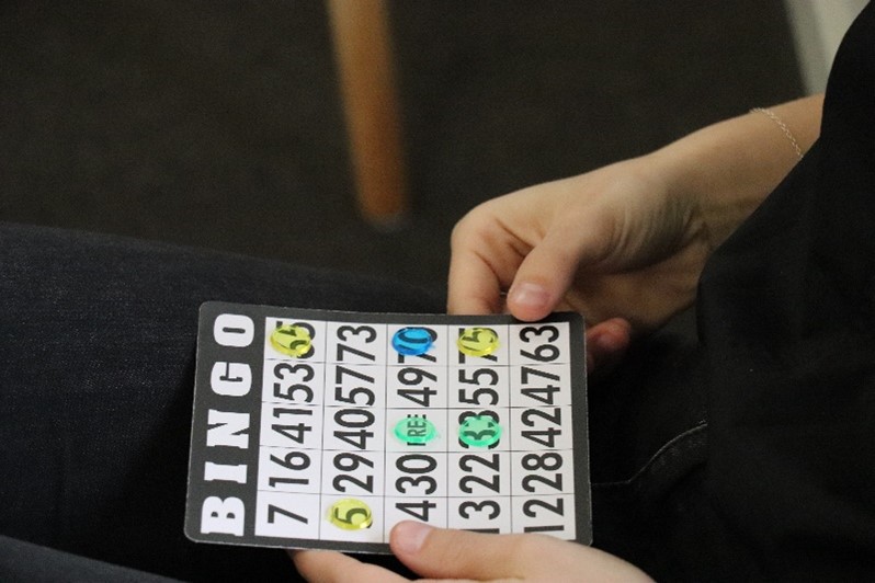 Colleagues playing Bingo together at the office