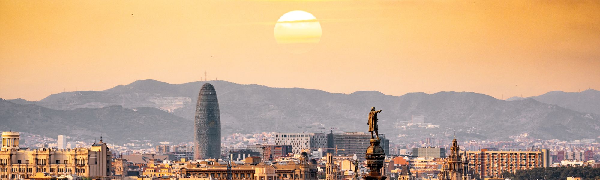 Person working remotely on laptop at a sunny beach destination